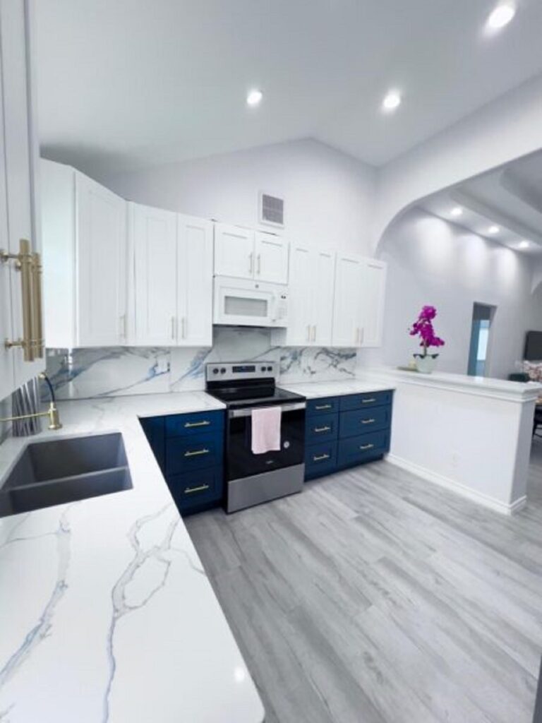 Modern kitchen remodeling project with white cabinets, blue island cabinets, quartz countertops in San Antonio, TX.