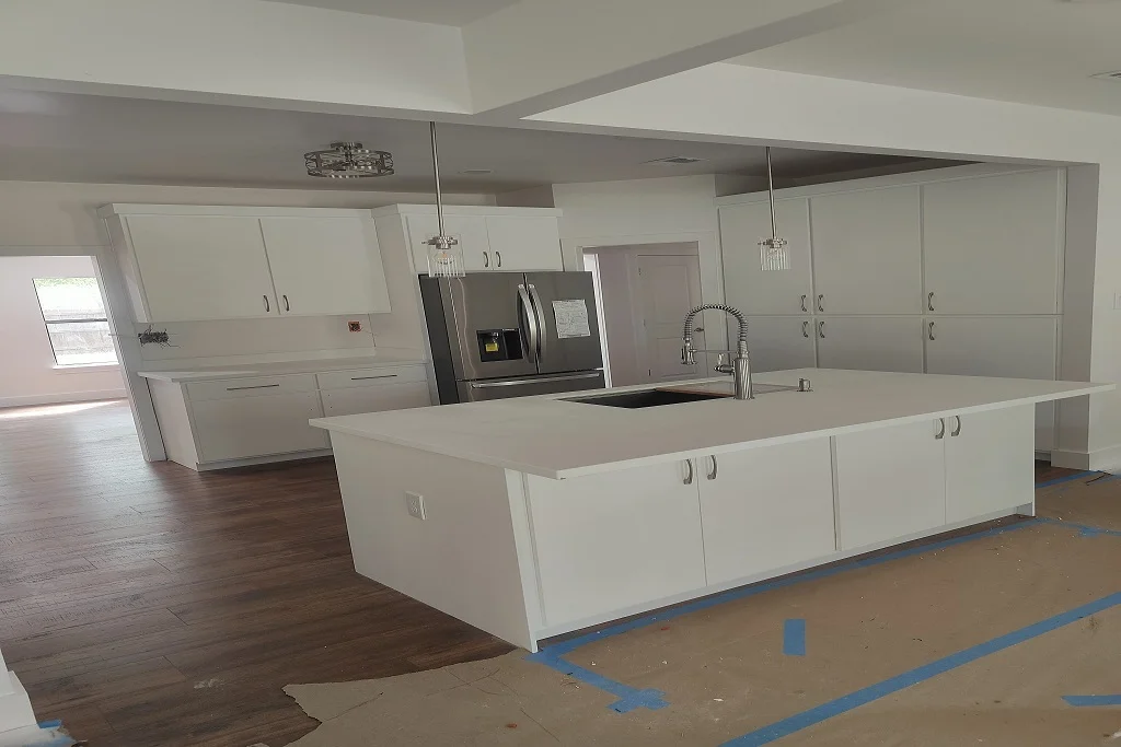 Modern custom kitchen remodeling project completed by JD Local Builders in San Antonio, TX, featuring granite countertops, shaker-style cabinets, and professional kitchen island installation.