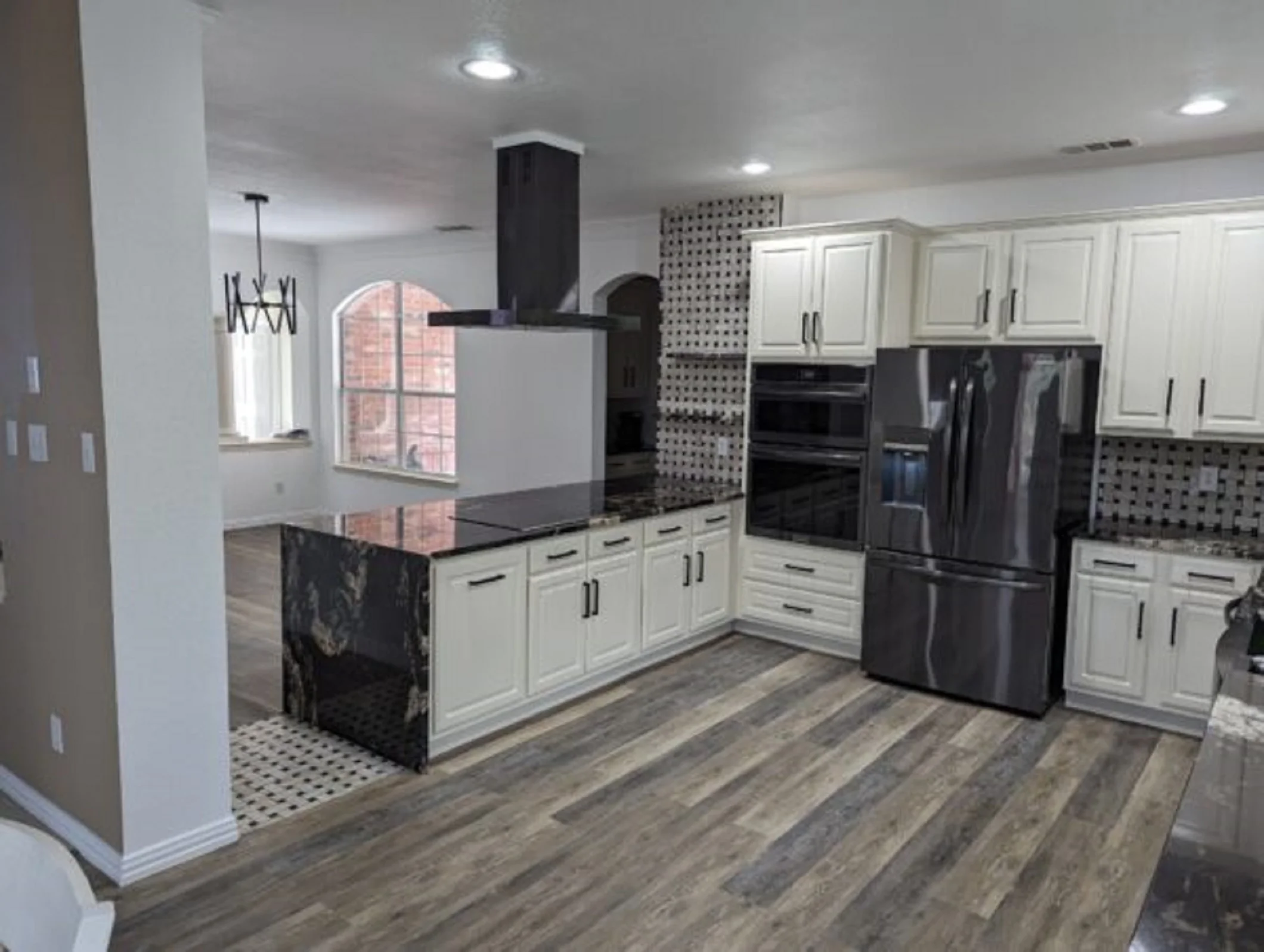 Modern kitchen remodeling project completed by JD Local Builders in San Antonio TX with custom cabinets, island, flooring, and countertops