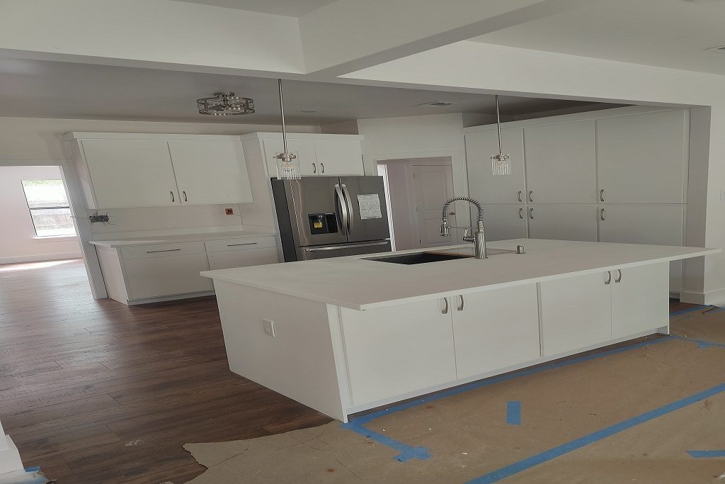 Custom Kitchen Remodeling and Renovation Services in San Antonio Modern custom kitchen remodeling project completed by JD Local Builders in San Antonio, TX, featuring granite countertops, shaker-style cabinets, and professional kitchen island installation.